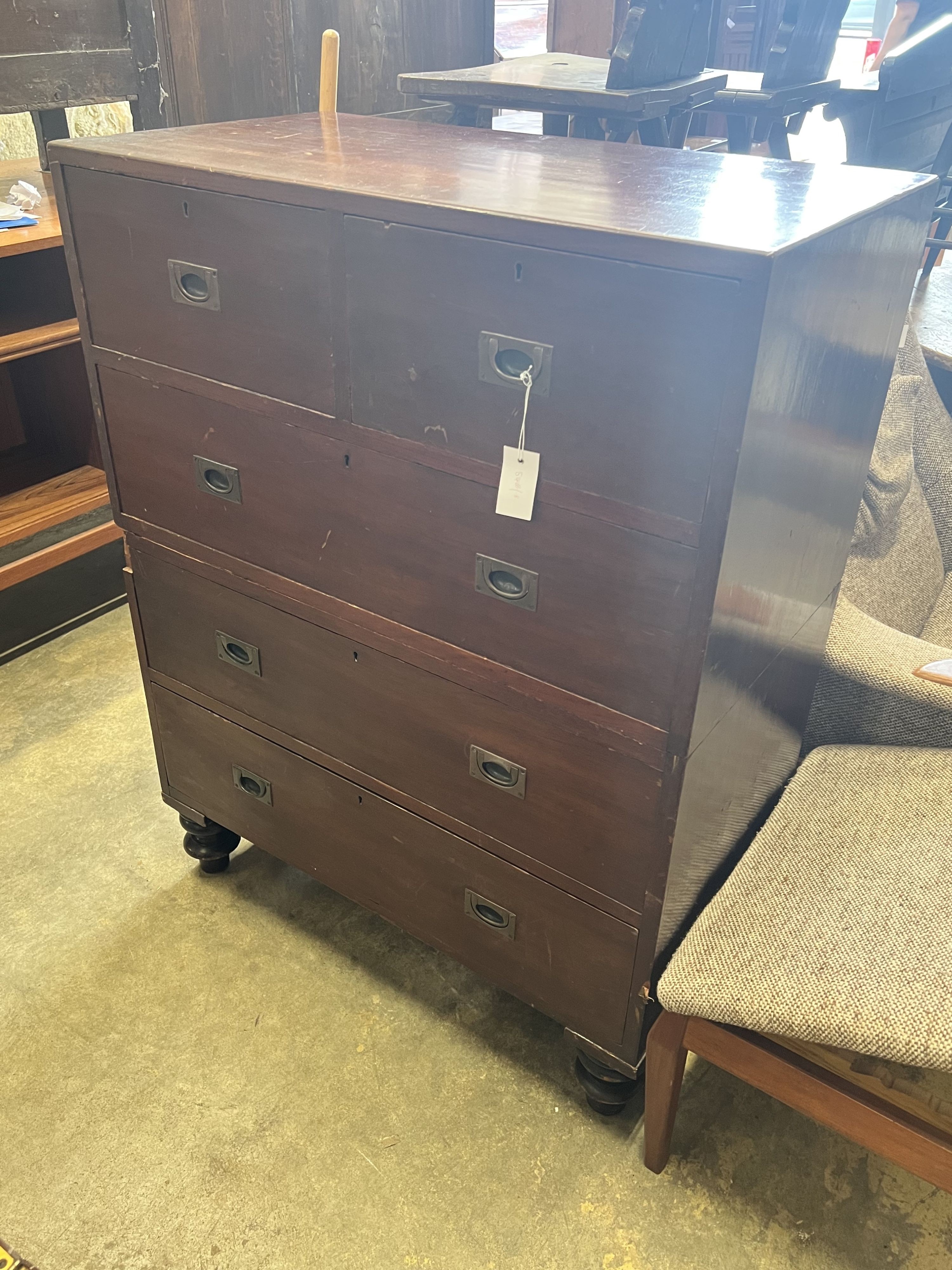 A 19th century teak two part military chest, bears paper label H.T. Jones & Sons, Parramatta, width 86cm depth 46cm height 113cm